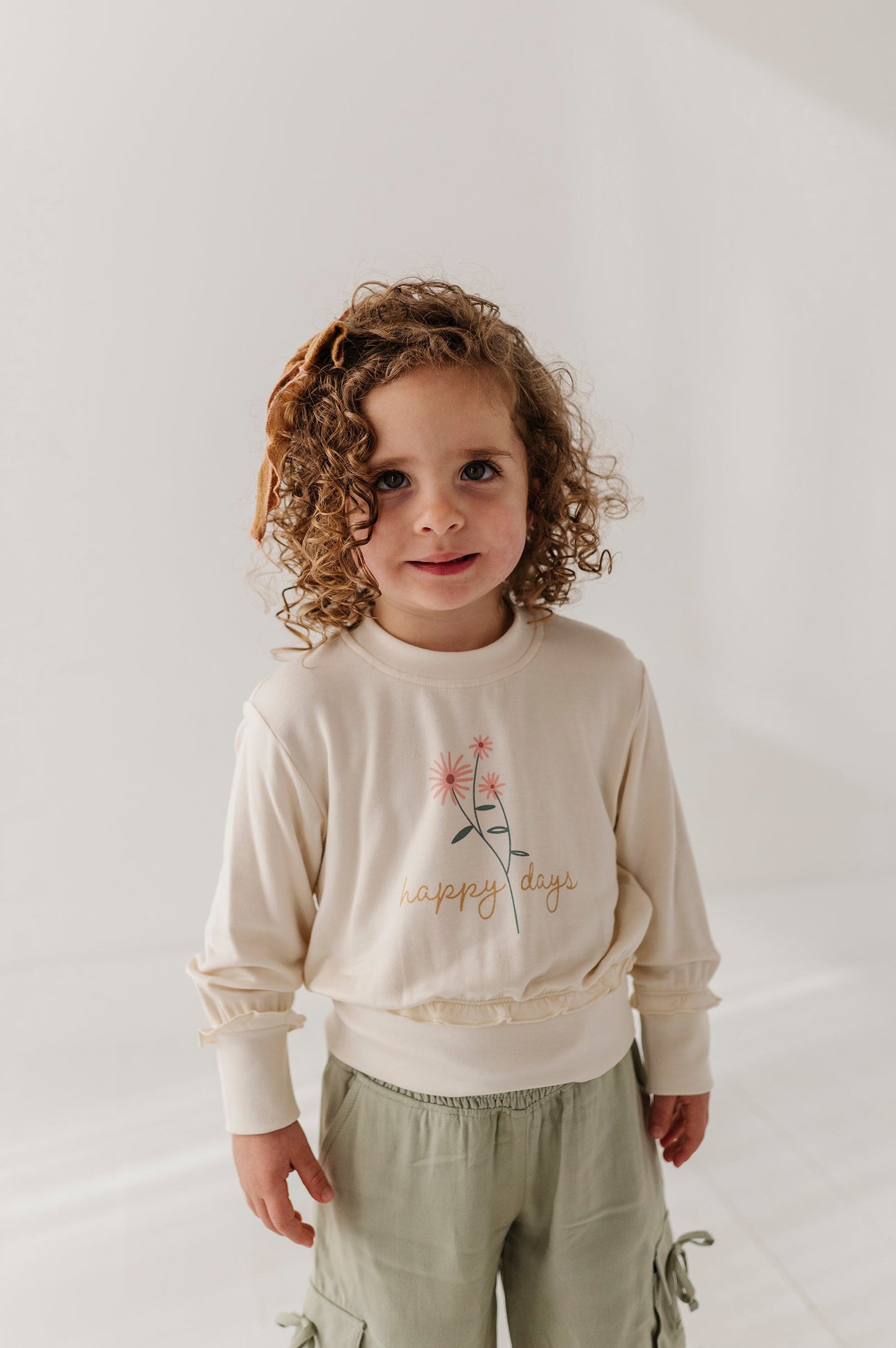 Girls Ruffle Hem Sweatshirt in Happy Days