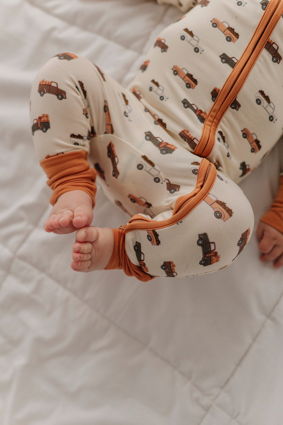 Baby Boy Long Sleeve Zip Romper in Pumpkin Trucks