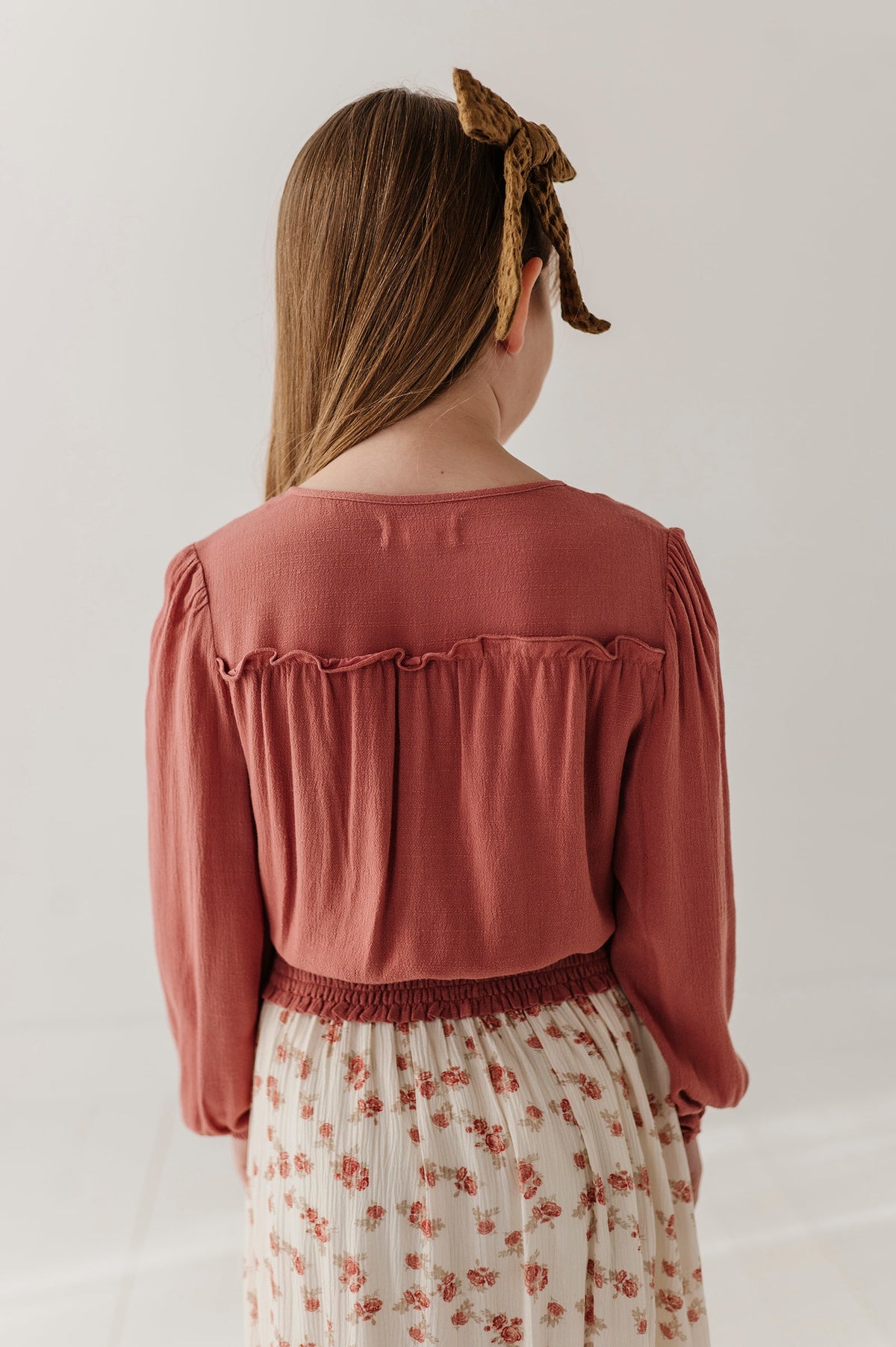 Girls Peasant Blouson Long Sleeve Top in Brick Dust